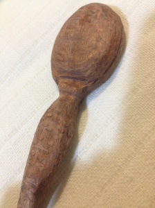 The reverse of the spoon shows that she has breasts.